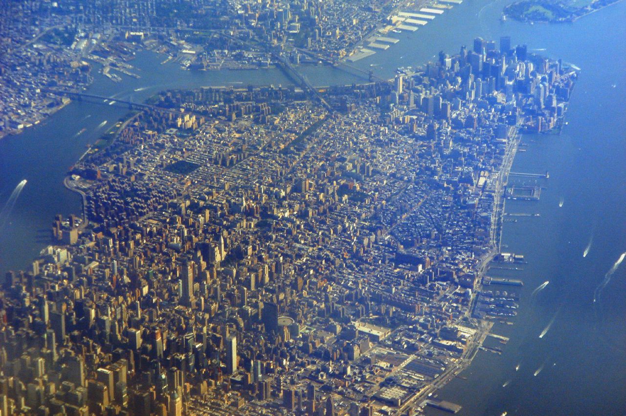 Figure 1: An aerial view of Manhattan including Midtown (lower left) and Downtown (upper right). Image Credit:  Global Jet via Flickr  ( License ) 