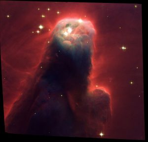 Some people argue the Cone Nebula looks like Jesus Christ — an example of perceiving a religious signal in what most likely is random noise. Credit: Wikipedia Commons