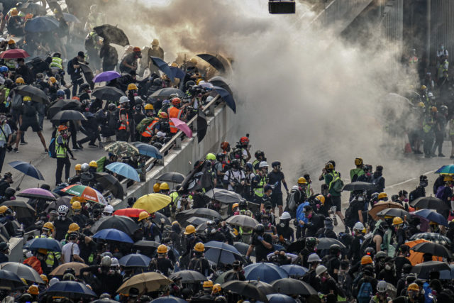 Hong Kong Police Force fire tear gas canisters at citizens protesting the controversial extradition bill.