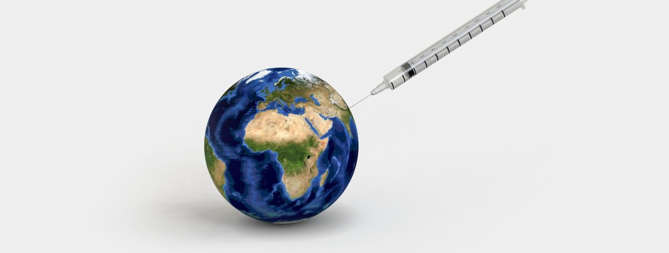 Image showing a vaccination syringe and a globe.